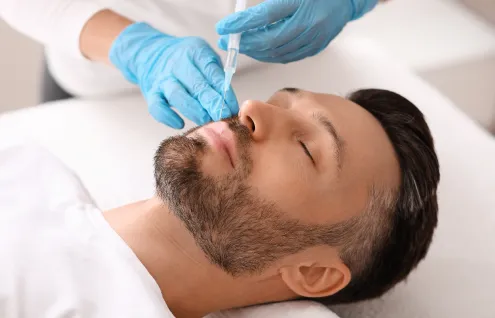 Man receiving a trigger joint injection